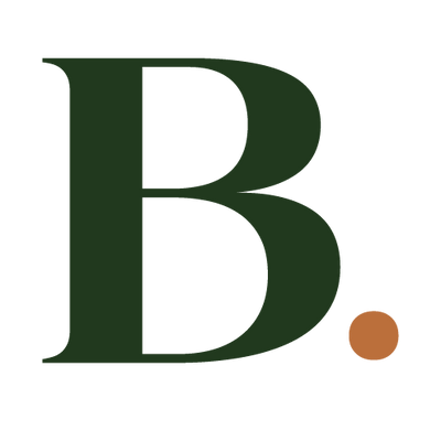 A dark green serif letter B with a small brown dot next to it, centered on a plain white background.